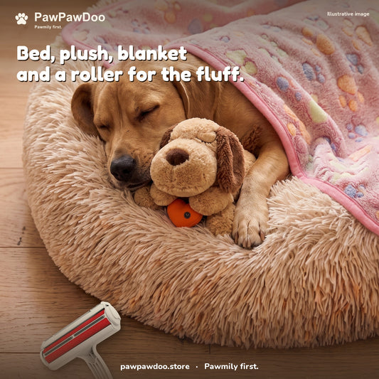 Dog asleep in a Cozy Nest bed with the heartbeat plush, a paw-print blanket tucked in and a hair roller on the floor