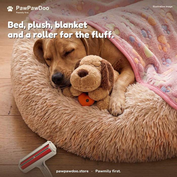 Dog asleep in a Cozy Nest bed with the heartbeat plush, a paw-print blanket tucked in and a hair roller on the floor