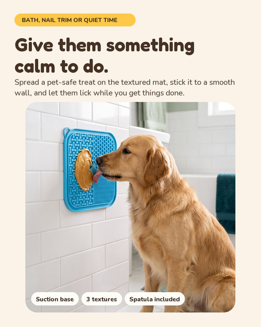 Give them something calm to do. A dog licks a spread-covered PawPawDoo lick mat stuck to a tile wall
